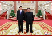 金正恩党委員長と栗戦書委員長